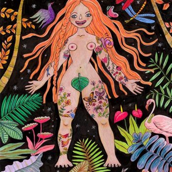 A naked and colorful tattooed redheaded woman stands in the middle of the jungle exposing her sensual body for all to view.