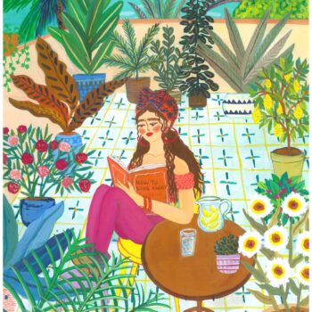 A young woman sits reading a book on a beautiful sunny day. A refreshing cold glass of homemade lemonade on the table in front of her.